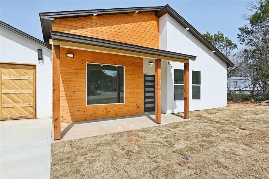 Rear view of property featuring stucco siding