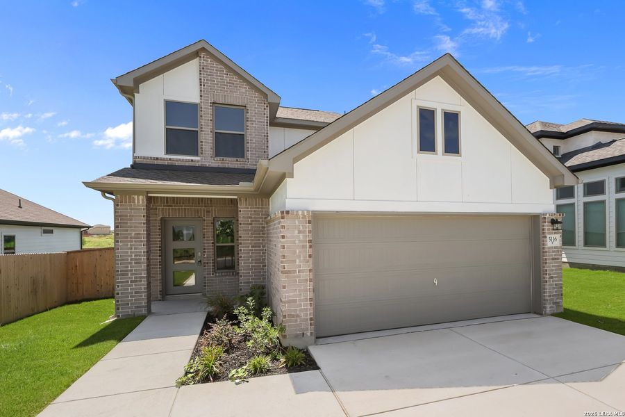 Front exterior of a new home in The Parklands, Schertz, TX, highlighting curb appeal (Image 23).