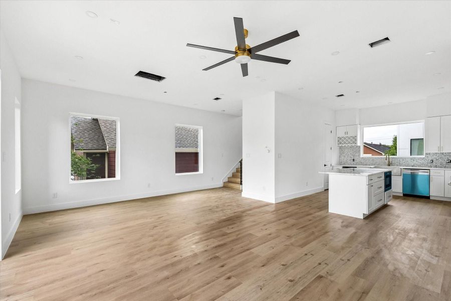 The home features wood-look LVP flooring throughout and offers a true no-carpet lifestyle.