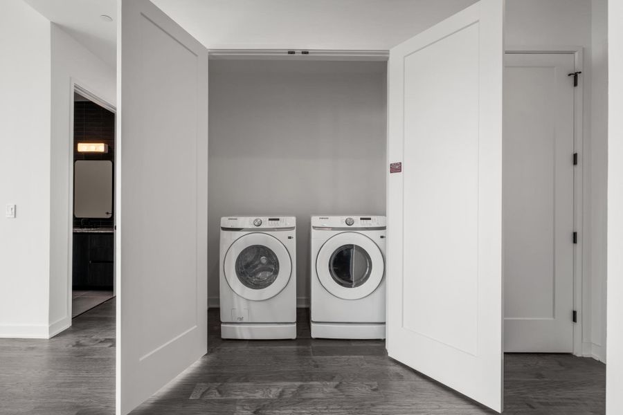 The laundry closet comes furnished with a new Samsung electric washer and dryer