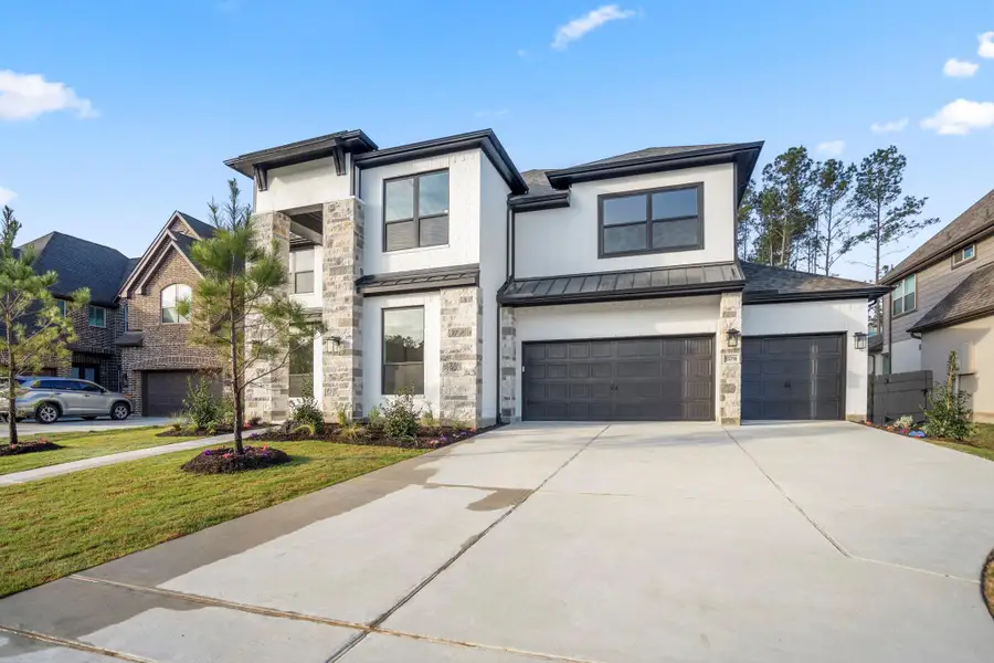 Front exterior of a new home in ARTAVIA 70′ Lots, Conroe, TX, highlighting curb appeal (Image 2).