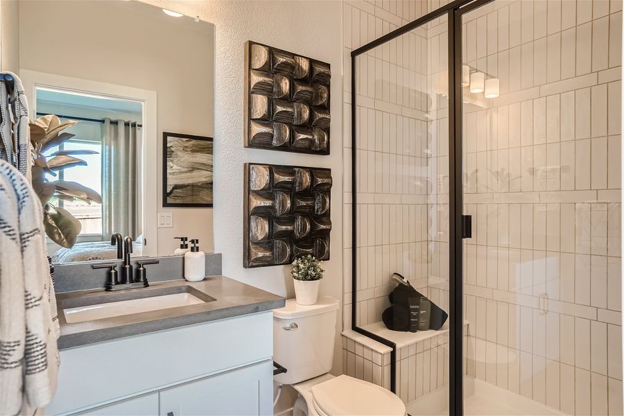 A bathroom with a glass shower. A bathroom with a glass shower.