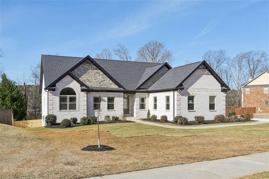 Front exterior of a new home in , Conyers, GA, highlighting curb appeal (Image 2). Front exterior of a new home in , Conyers, GA, highlighting curb appeal (Image 2).