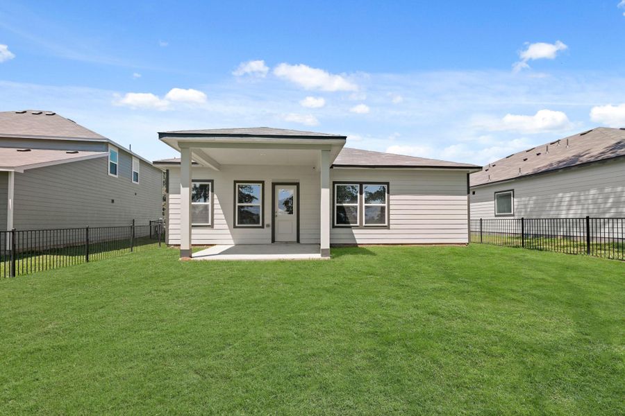 Front exterior of a new home in Lakes at Crockett Martin, Conroe, TX, highlighting curb appeal (Image 14). Front exterior of a new home in Lakes at Crockett Martin, Conroe, TX, highlighting curb appeal (Image 14).