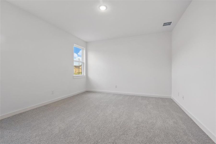 Unfurnished room with light carpet and baseboards
