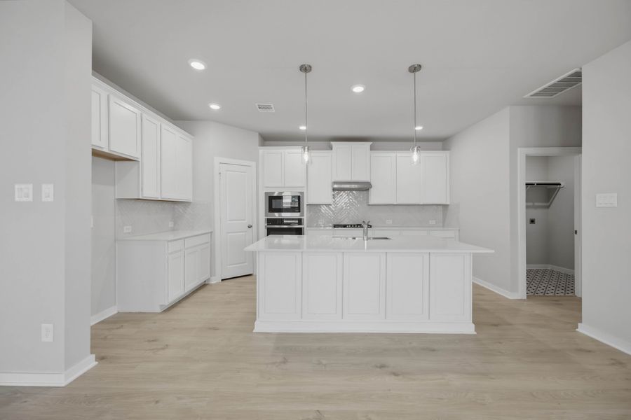 Furnished interior view inside a new home in Sunterra 40, Katy (Image 9).