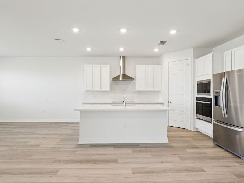 Furnished interior view inside a new home in Crescent Lakes - Signature Series, Punta Gorda (Image 5).