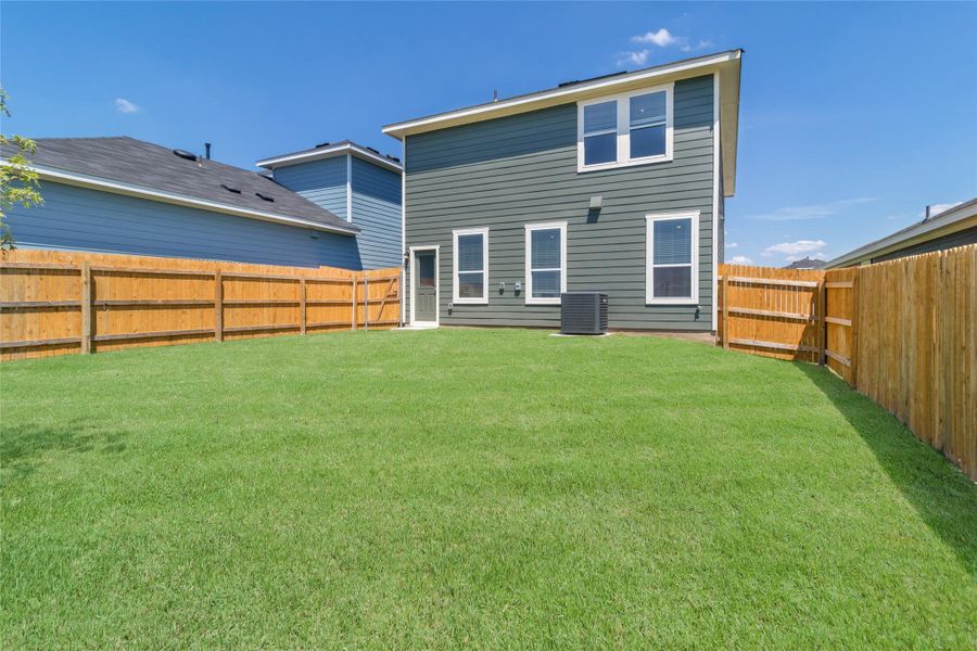 Front exterior of a new home in Marigold, Uhland, TX, highlighting curb appeal (Image 17).