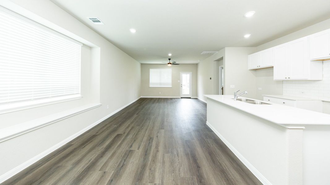Dining Area to Kitchen and Family Room Dining Area to Kitchen and Family Room