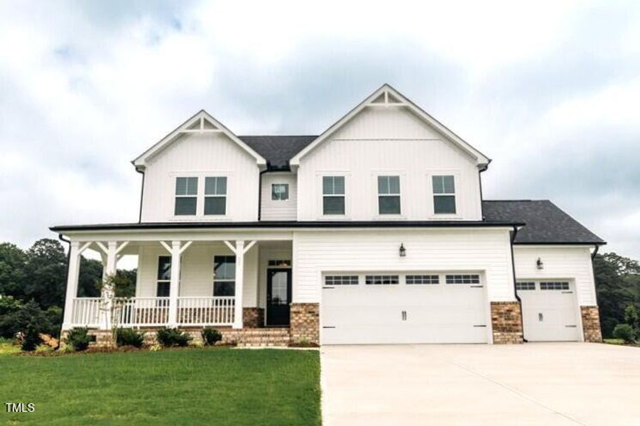 Front exterior of a new home in Tobacco Road, Angier, NC, highlighting curb appeal (Image 100). Front exterior of a new home in Tobacco Road, Angier, NC, highlighting curb appeal (Image 100).