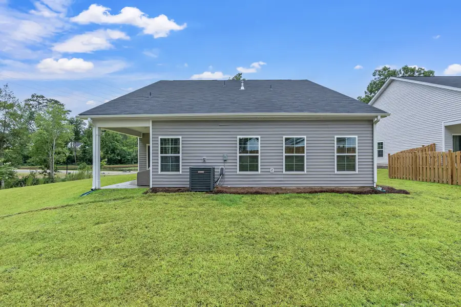 Front exterior of a new home in Harmon Hill Estates, Hopkins, SC, highlighting curb appeal (Image 2).