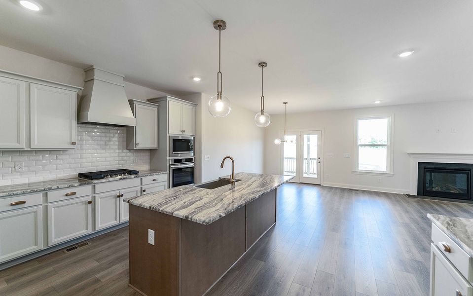 Furnished interior view inside a new home in Aden Woods, Fairview (Image 5).