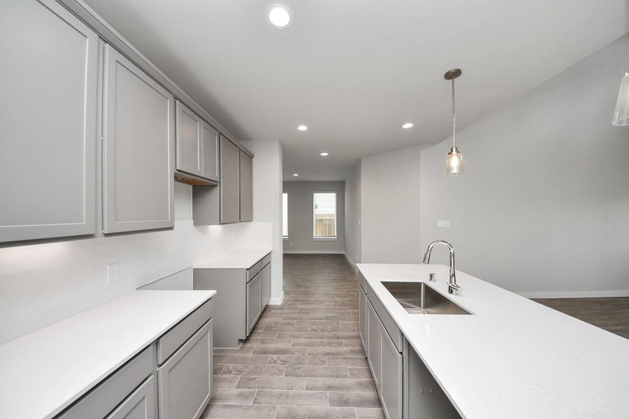 This generously spacious kitchen is a dream realized! Sample photo of completed home with similar floor plan. Actual colors and selections may vary.