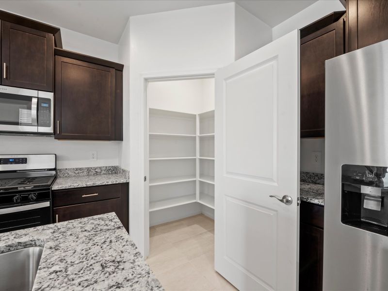 Furnished interior view inside a new home in Las Patrias at Star Valley Phase III - Signature Series, Tucson (Image 4). Furnished interior view inside a new home in Las Patrias at Star Valley Phase III - Signature Series, Tucson (Image 4).