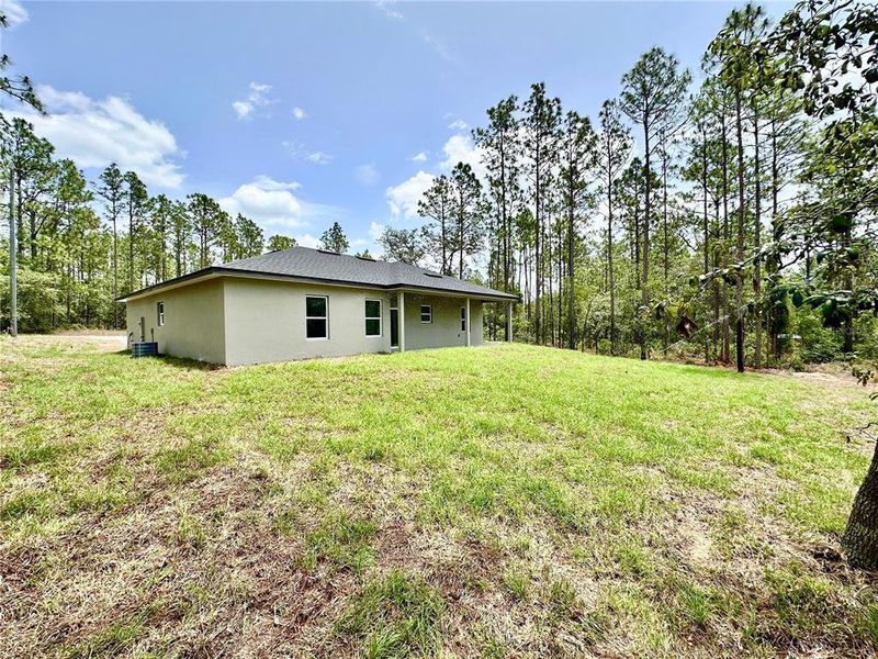 Exterior details and patio area of a home in , Citrus Springs (Image 22).