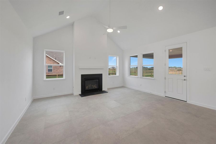Open great room with cozy fireplace Open great room with cozy fireplace