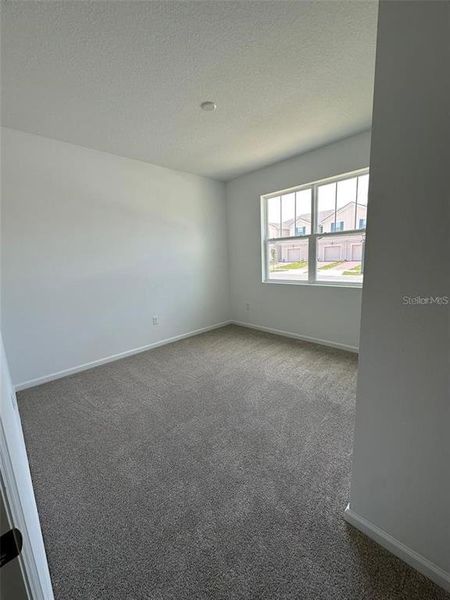 Spacious, unfurnished interior of a new home in Soleil, Kissimmee (Image 24).