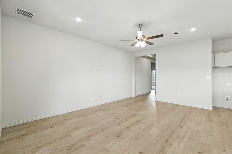 Empty room with light wood-type flooring, recessed lighting, and ceiling fan Empty room with light wood-type flooring, recessed lighting, and ceiling fan
