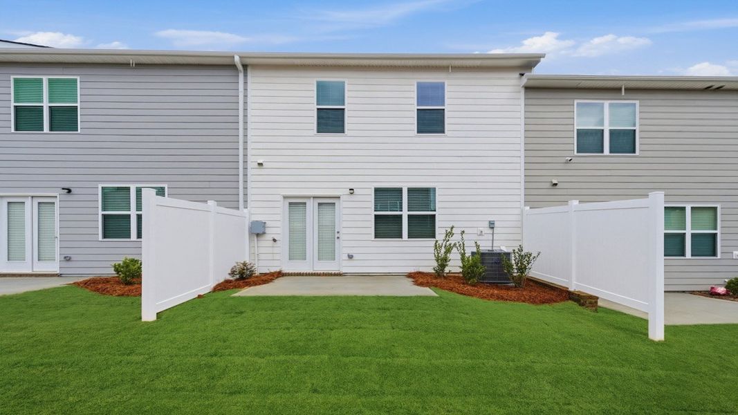 Exterior details and patio area of a home in Independence Villas and Townhomes, Loganville (Image 3).