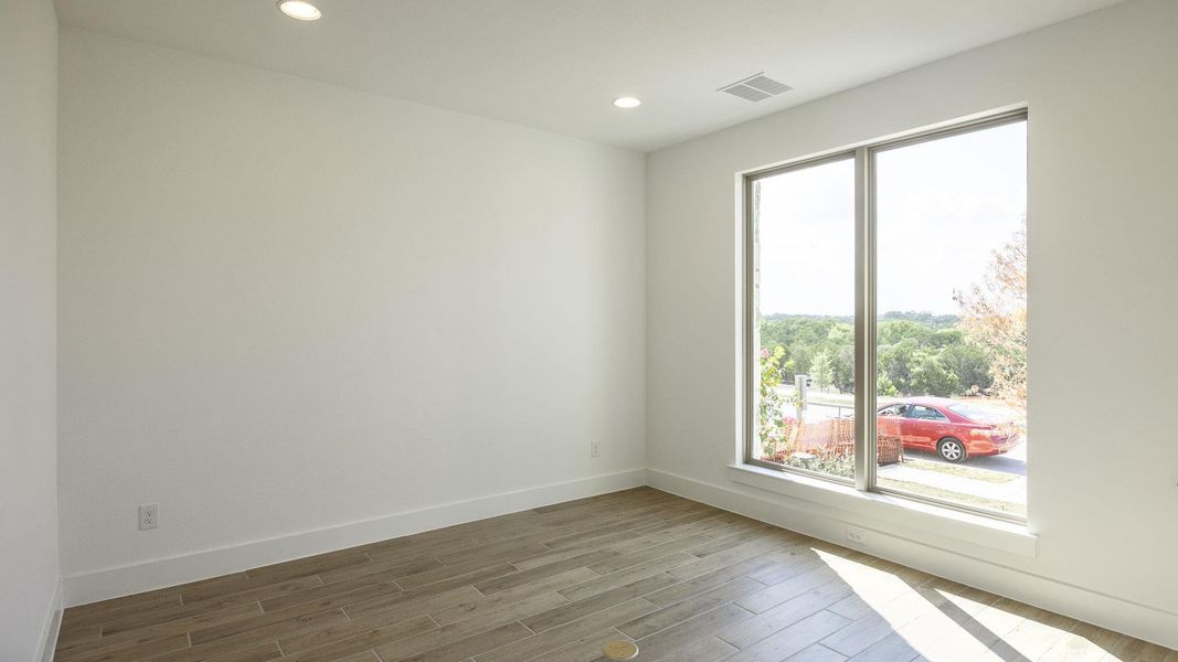 Spare room with recessed lighting and light wood-type flooring