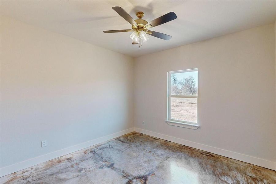 Empty room featuring ceiling fan