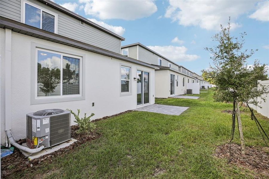 Exterior details and patio area of a home in Cyrene at Minneola - Villas, Minneola (Image 3).