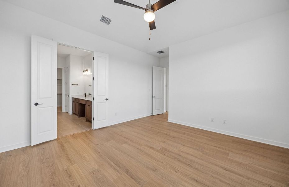 Representative unfurnished interior of a home built from the Wheeler by Pulte Homes in West Cypress Hills, Spicewood (Image 31).