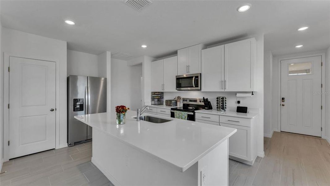 Furnished interior view inside a new home in The Grove at Stuart Crossing - Premier Series, Bartow (Image 30).