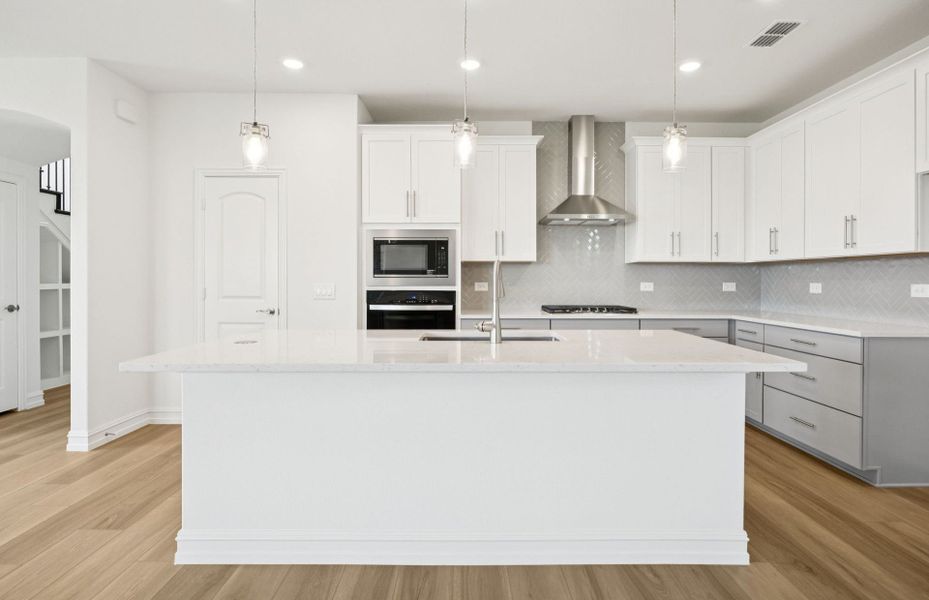 Kitchen featuring a large island ideal for informal dining and gatherings *Real home pictured Kitchen featuring a large island ideal for informal dining and gatherings *Real home pictured