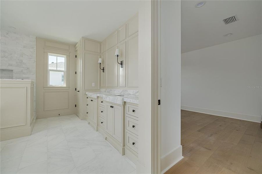 The primary bathroom. Here, you can see the large walk-in closet.