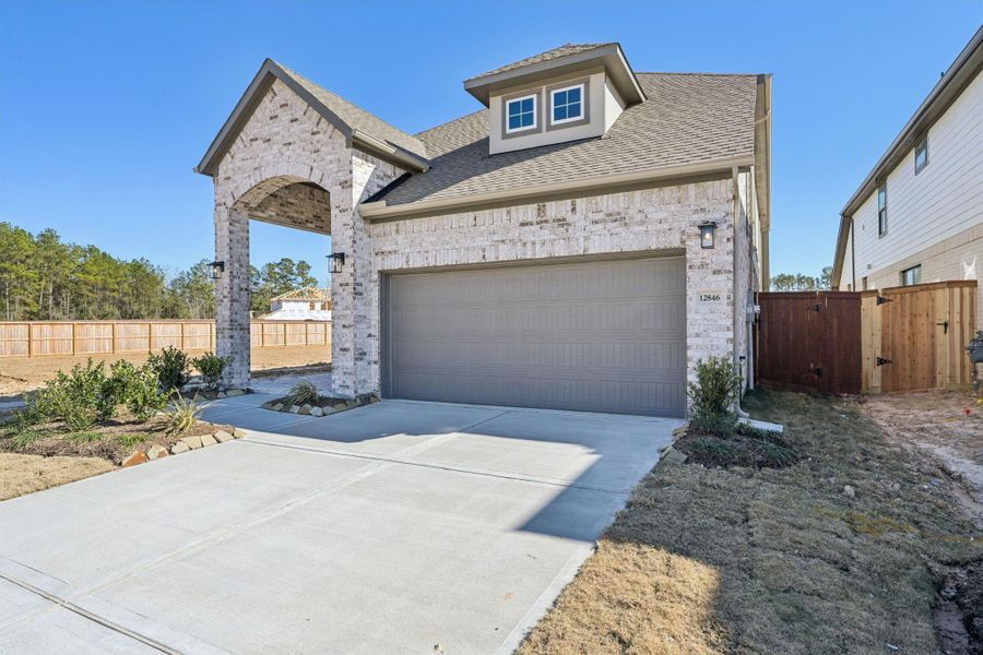Front exterior of a new home in Evergreen, Conroe, TX, highlighting curb appeal (Image 17).