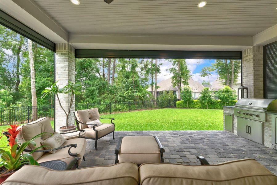 From the covered patio, the backyard feels open, private, and beautifully framed by trees. The generous lawn provides space to play, garden, entertain, or explore a future pool design.