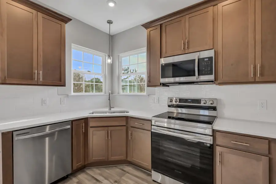 Rose Atoll Kitchen with Stainless Steel Appliances