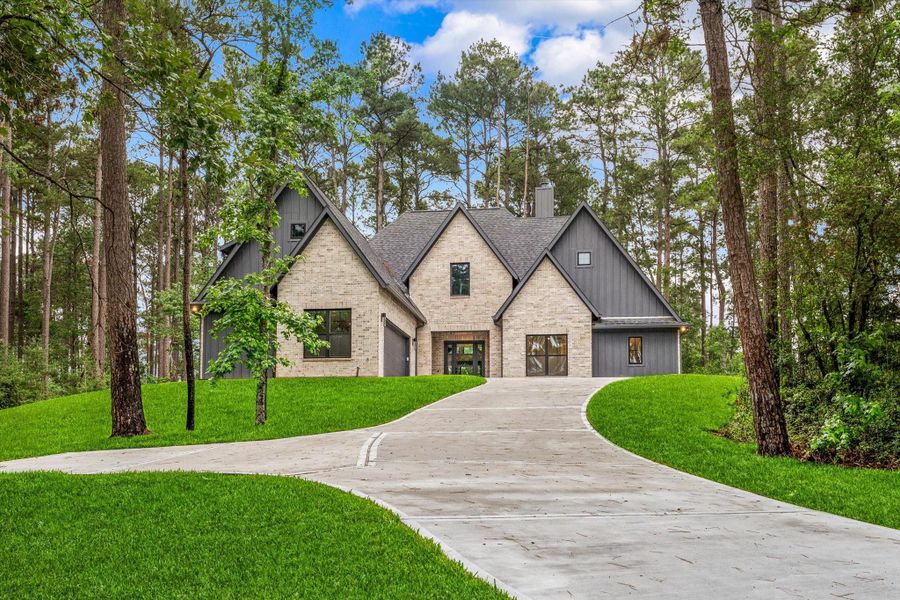 Front exterior of a new home in , Huntsville, TX, highlighting curb appeal (Image 1). Front exterior of a new home in , Huntsville, TX, highlighting curb appeal (Image 1).