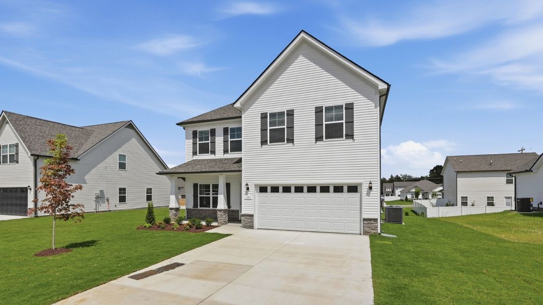 Front exterior of a new home in Wheatfield, Shelbyville, TN, highlighting curb appeal (Image 16).