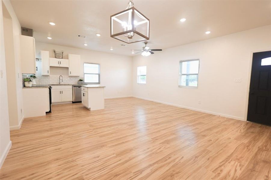 Unfurnished living room featuring recessed lighting, a ceiling fan, and light wood finished floors