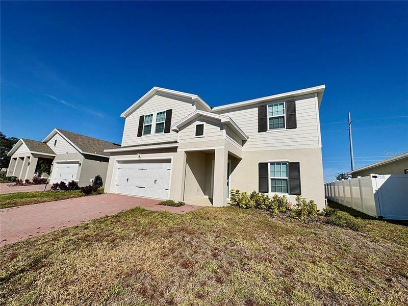 Front exterior of a new home in , Haines City, FL, highlighting curb appeal (Image 26).