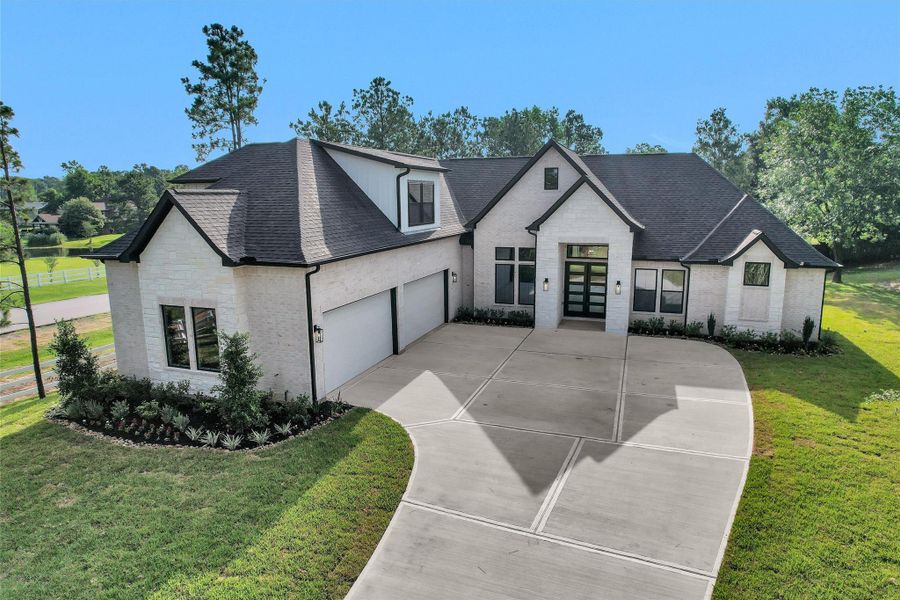 Front exterior of a new home in , Montgomery, TX, highlighting curb appeal (Image 25). Front exterior of a new home in , Montgomery, TX, highlighting curb appeal (Image 25).