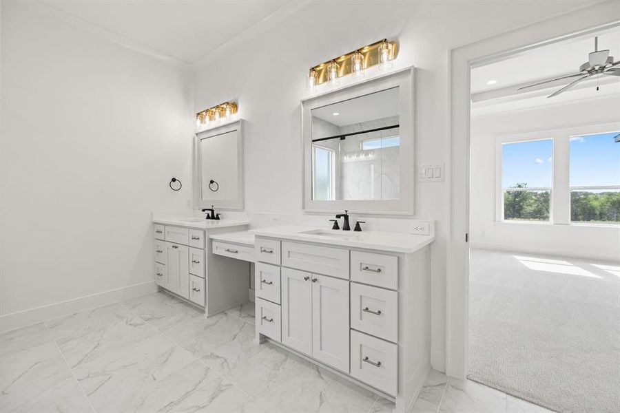 Bathroom featuring recessed lighting, vanity, marble finish floor, and baseboards