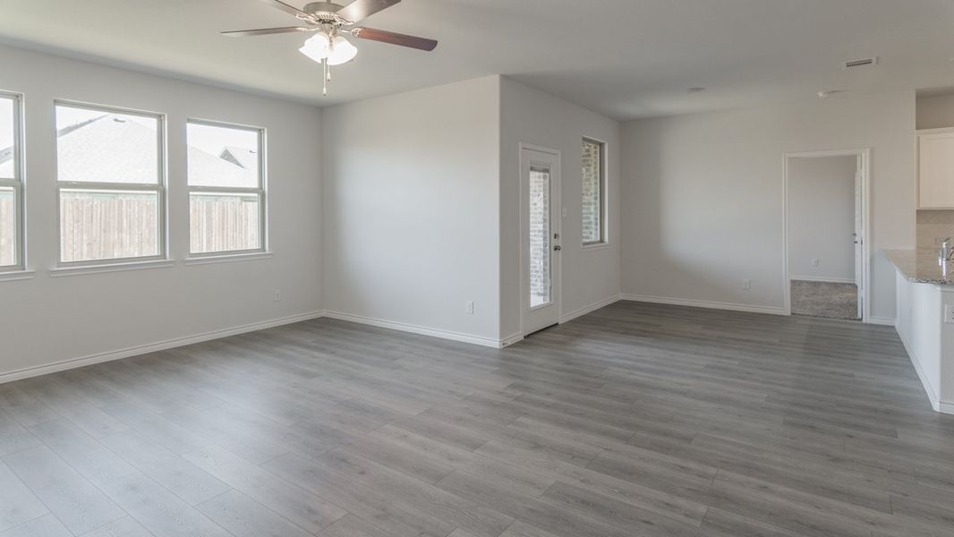 Representative unfurnished interior of a home built from the Medbourne by D.R. Horton in Woodcreek, Fate (Image 8).