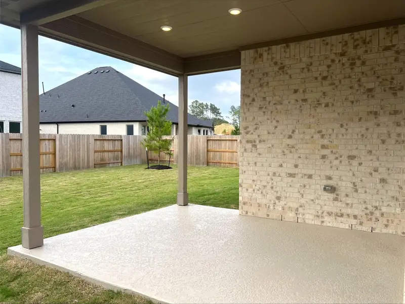 Exterior details and patio area of a home in , Magnolia (Image 2). Exterior details and patio area of a home in , Magnolia (Image 2).