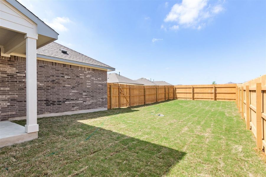View of yard featuring a fenced backyard