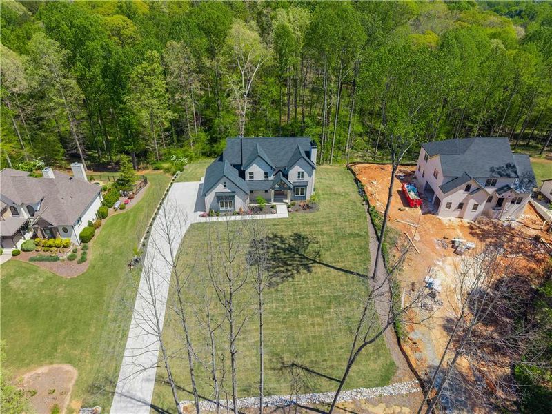 Front exterior of a new home in , Hoschton, GA, highlighting curb appeal (Image 27).