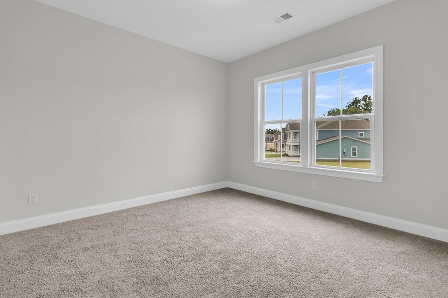 Spacious, unfurnished interior of a new home in Tidewater at Lakes of Cane Bay, Summerville (Image 49).