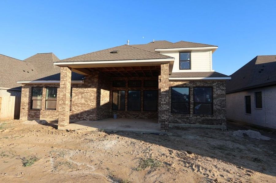 Exterior details and patio area of a home in Riceland 60’ Homesites, Mont Belvieu (Image 3). Exterior details and patio area of a home in Riceland 60’ Homesites, Mont Belvieu (Image 3).