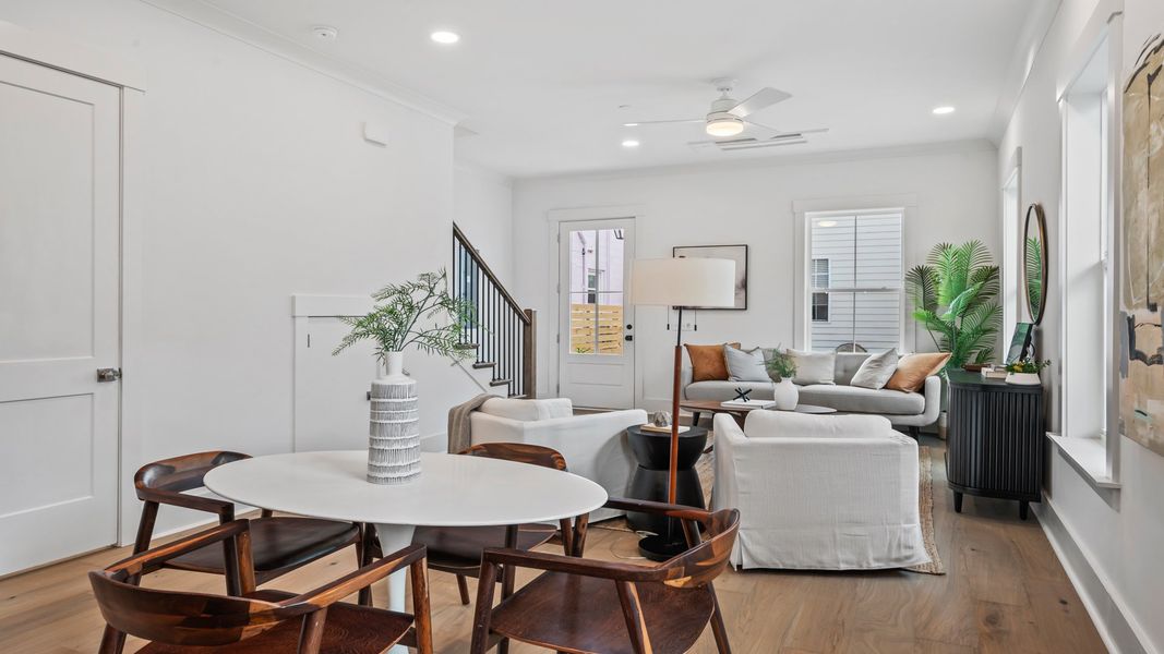 The Sullivan show case home offers an inviting living room with open-concept design and abundant natural light.