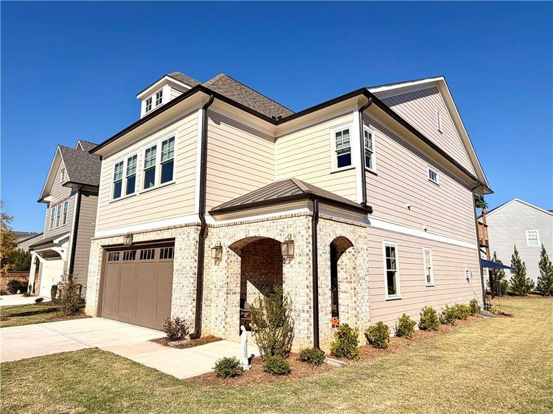 Front exterior of a new home in , Canton, GA, highlighting curb appeal (Image 1). Front exterior of a new home in , Canton, GA, highlighting curb appeal (Image 1).