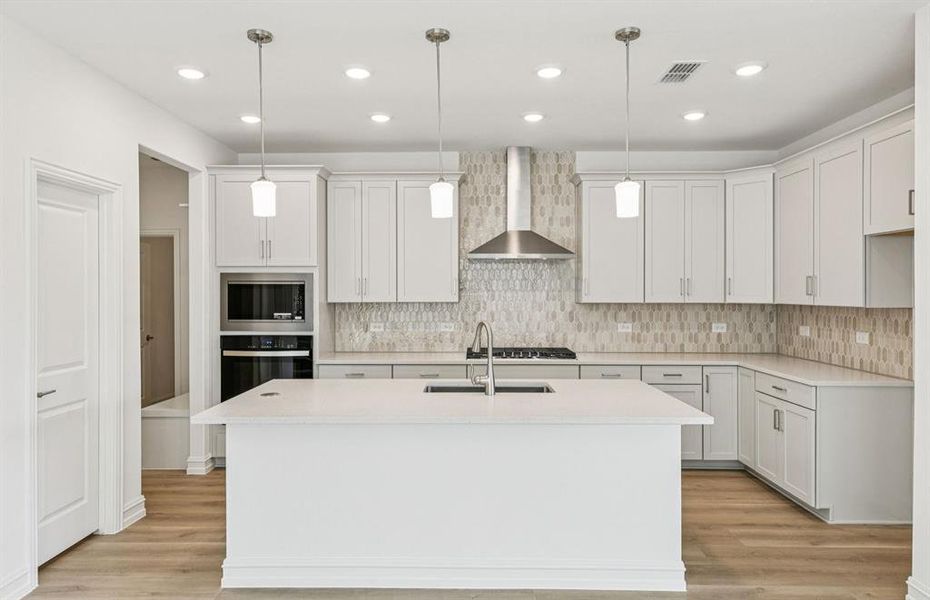 Spacious eat-in kitchen designed with a large island for dining Spacious eat-in kitchen designed with a large island for dining