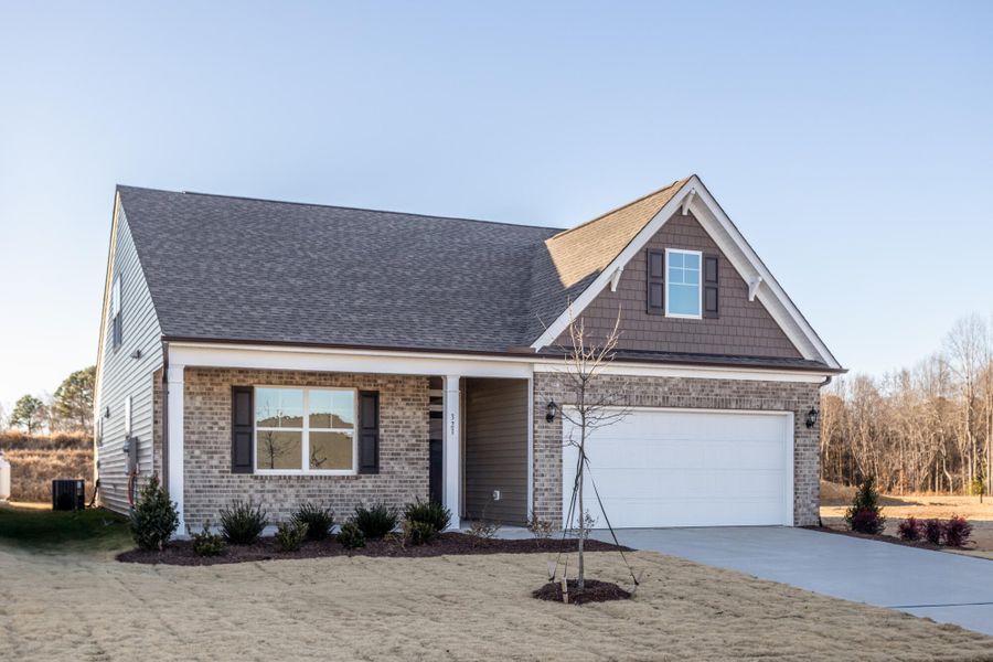 Front exterior of a new home in Daniel Farms, Benson, NC, highlighting curb appeal (Image 2). Front exterior of a new home in Daniel Farms, Benson, NC, highlighting curb appeal (Image 2).