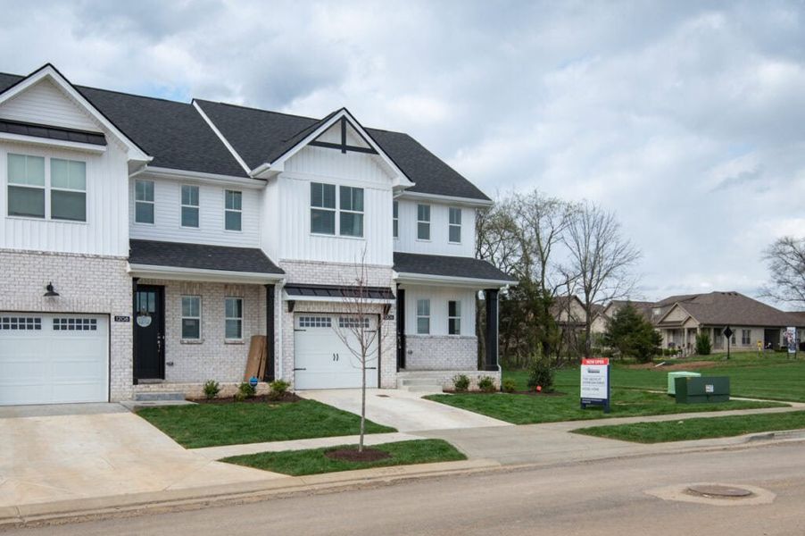 Front exterior of a new home in The Grove at Kennesaw Farms, Gallatin, TN, highlighting curb appeal (Image 1). Front exterior of a new home in The Grove at Kennesaw Farms, Gallatin, TN, highlighting curb appeal (Image 1).